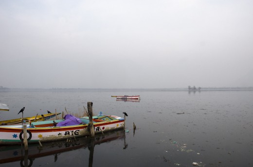 A freshly painted family fishing boat floats loose after a storm
