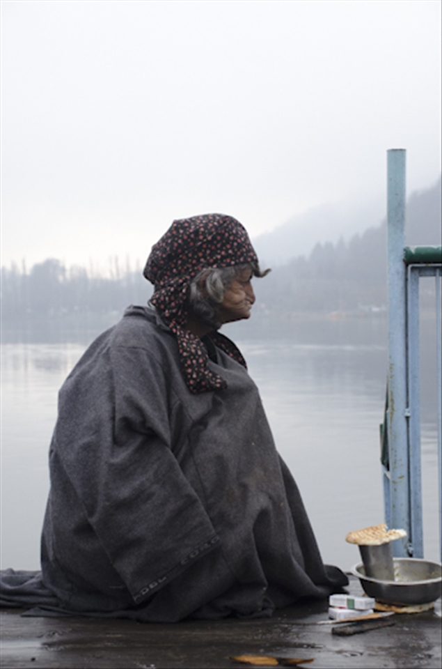 A local women who lost her son years ago, sits alone on a family run houseboat.