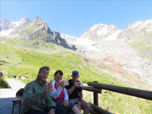 Well earned drink after 15km of walking outside Rifugio.Glaciers behind
