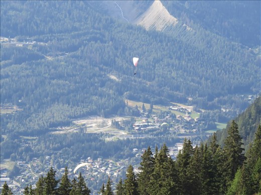 Looking down to Chamonix - one of many paragliders - sunny still day