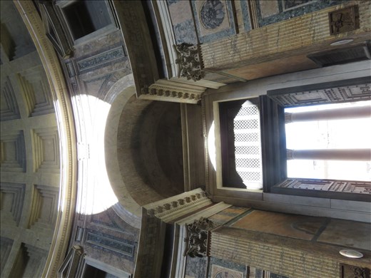 Rome - Pantheon - skylight in ceiling throws light on side wall - roman clock ?
