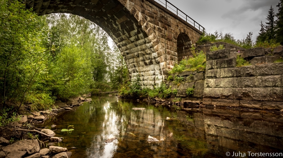 Traveling outside the city to find an old bridge. Summer.