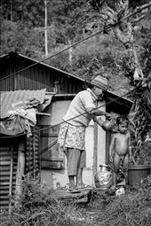 Difference often makes us laugh. Not for superiority’s sake, but simply because we don’t know what to make of it initially.  Again a mother’s love prevails as the familiar element in this photograph, but of course what we see first is a little nude boy having a bath outside in the not-so-sunny weather. Kalimpongians do not have the easiest access to clean water, especially those living so far from the centre, so we can only assume this was a rare treat for the boy.: by juliezhu, Views[156]