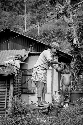 Difference often makes us laugh. Not for superiority’s sake, but simply because we don’t know what to make of it initially.  Again a mother’s love prevails as the familiar element in this photograph, but of course what we see first is a little nude boy having a bath outside in the not-so-sunny weather. Kalimpongians do not have the easiest access to clean water, especially those living so far from the centre, so we can only assume this was a rare treat for the boy.