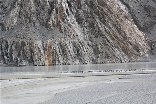 The catchword at the end of the Attabad Lake.
KNM (Karakorum National Movement) - an organization struggling for the independency of Karakorum. Their aim  is to cut off from the rest of Pakistan. Residents of this area differ from the rest of Pakistani in origin, language and appearance. They are tired of existence under the rule of the corrupt Pakistani government. 
Maybe an utopian motto, but still beautiful – is this what you expected to hear in this part of the world?
 
