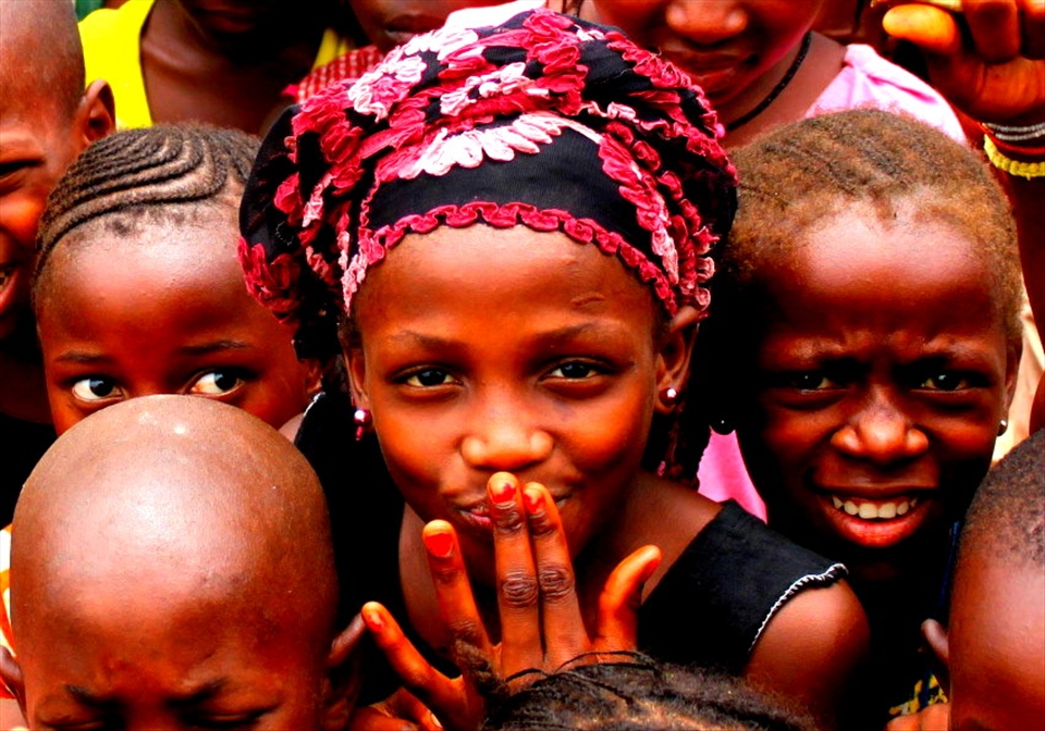 Traveling to Laya Sando Guinea we stopped for lunch at a unnamed village (Not on a map), this village helped change my perspective of life. When our truck stopped, children of all ages and sizes came running to surround us. When we got off the truck the children reached out and touched us, they were giggling, laughing and their excitement were infectious. As it turned out we were the first white person they have ever seen.