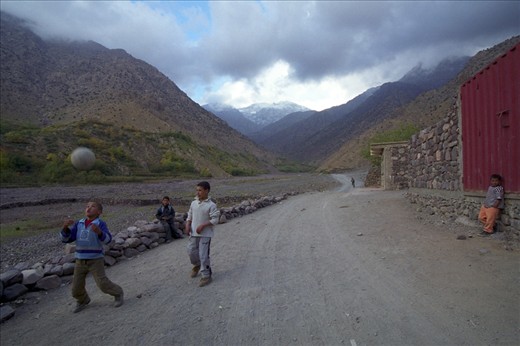 The area around the village of Imlil in the Atlas Mountains is stunning, so we spent several days hiking there.  One day we headed out into some neighbouring hills.  The trail that we were on came down to a road and as we were crossing it, we saw some of the local children coming towards us. At first they were a little shy, but it didn’t take long before they wanted to show their skills with the football…and only a couple of minutes more before they were happy to play a quick game with us.