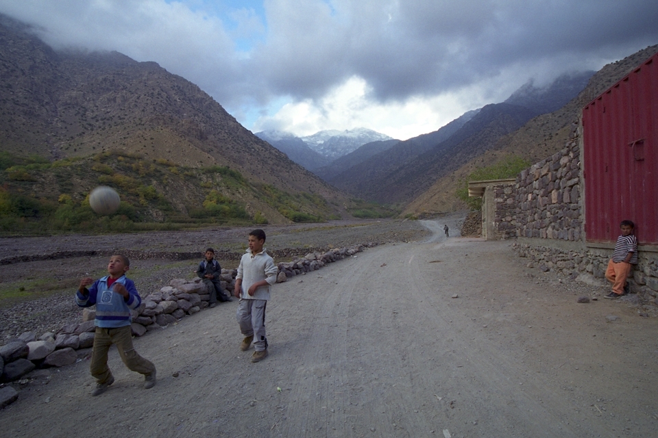 The area around the village of Imlil in the Atlas Mountains is stunning, so we spent several days hiking there.  One day we headed out into some neighbouring hills.  The trail that we were on came down to a road and as we were crossing it, we saw some of the local children coming towards us. At first they were a little shy, but it didn’t take long before they wanted to show their skills with the football…and only a couple of minutes more before they were happy to play a quick game with us.