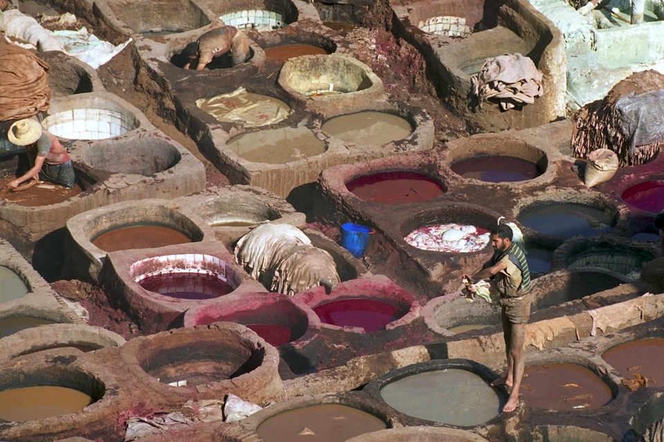 In the heart of the souk in Fes is an area devoted to the dying of leather.  If you look across the dye pits, you can see the rooftops of the many surrounding buildings & sense the hectic activity taking place there.  But the dye pits feel removed from the commotion, as the men go about their work.  It doesn’t matter that it takes a lot of labour, or that they may be waist-deep in dye as they stomp the leather beneath their feet…the leather is dyed how it has been for years – by hand & by foot