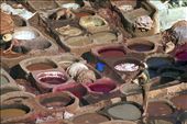 In the heart of the souk in Fes is an area devoted to the dying of leather.  If you look across the dye pits, you can see the rooftops of the many surrounding buildings & sense the hectic activity taking place there.  But the dye pits feel removed from the commotion, as the men go about their work.  It doesn’t matter that it takes a lot of labour, or that they may be waist-deep in dye as they stomp the leather beneath their feet…the leather is dyed how it has been for years – by hand & by foot: by justinekain, Views[593]
