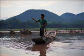 A young man heads home after a day's work in Luang Prabang. The Mekong is the highway, breadbasket and playground of the people who live in settlements along its banks. From childhood, they are taught to work with the natural rhythms of the river, learning to maneuver their long, low boats through the river's flow with confidence and ease.: by justintreadwell, Views[813]