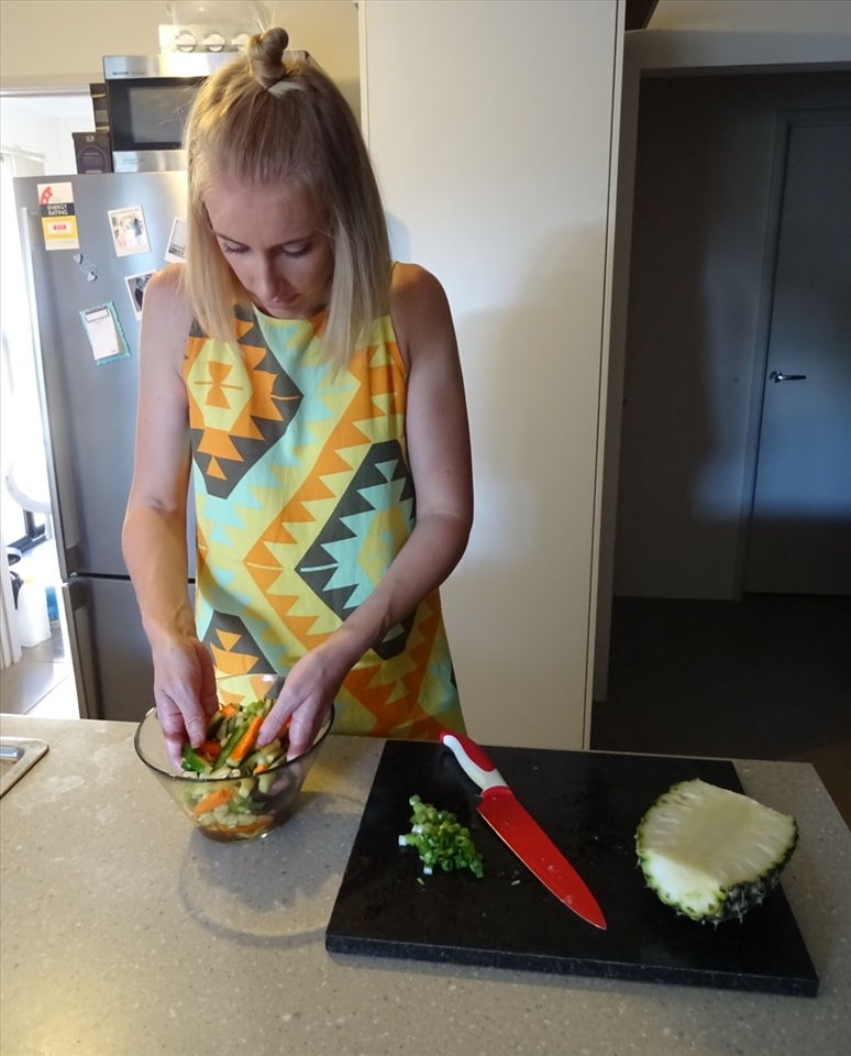 Mixing the carrot and cucumber pickle.