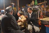 At a small local bazaar, several patrons and stallholders put aside the realities of life and gather for a casual chat. Amidst a dusty desert town landscape, the Uyghurs find their joy in simple ways like this.: by jynkx7, Views[374]