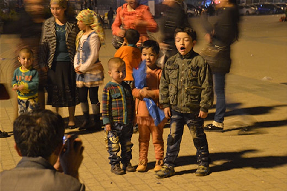Even just a night out in the town square is a special occasion. Almost as if to compensate for the drab landscape, children and women deck out in bright colours and elaborate outfits, and pose for a photograph in the plaza.