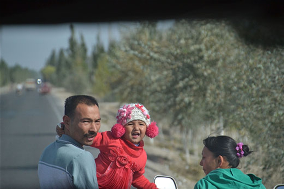 As our tour bus driver takes us down the three-hour route he plies daily, he passes a woman and kid riding home on a scooter, and they all pull over to the road shoulder. From the rear of the bus, we watch as he plants a kiss on the woman and pick his little girl up high in the air. He speaks no English, but when the little family gathering is over and it’s back to work, he climbs back in his seat, flashes a small crooked smile to himself, and hums a soft tune all the way down the road.