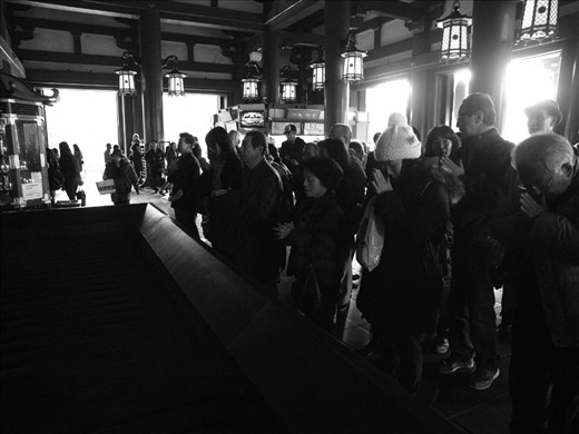 In the temple, eveyone pray for what they care, things, family.