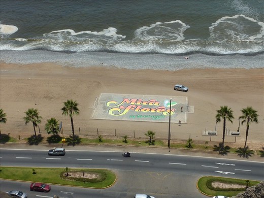 Mira Flores sign on the beach - this is the only bit of sand on the beach as it is mainly gravel and has very steep hills on the side of the.coastal road - there is even a sign indicating a tsunami evacuation route.