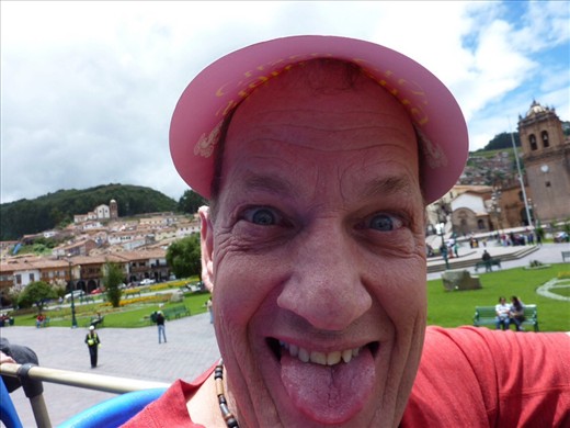 Rob on the typical tourist bus trip.  It got quite warm so they gave us cardboard visors - seemed silly but it was hot up there.