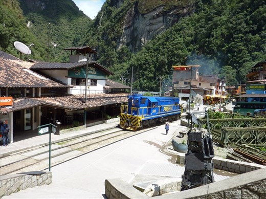 The train goes straight through the middle of town.  All supplies are bought in on the train and men carry or barrow them to the respective business.  Not a job for the faint hearted.