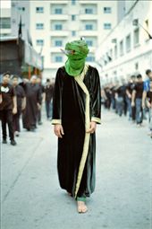This is the reenactment of the suffering and death of the Islam Martyr Imam Husayn. Presented on the 9th day of Muharram, participants wearing black punish themselves with chains as the one playing the role of Husayn walks on with a sword appearing to be punctured on his head.: by kaharian, Views[1338]