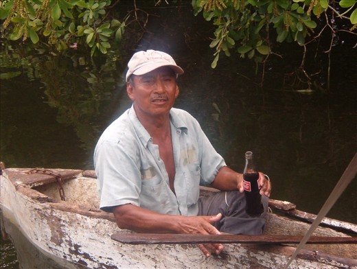 A fisherman I met along the Northern River.  He builds his own boats, each of which lasts about 8-10 years. He claimed to be 70, and anticipated building one more boat in his lifetime. While he maintains the same lifestyle and practices the same techniques as his ancestors, a Coke was a welcome refreshment. The most interesting aspect of this shot to me is the halo effect around the man. Nothing else in the shot has that blur, including the boat. It speaks to the fact that he is so adept on the water, he was able to move in the boat without moving the boat on the water.