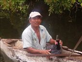 A fisherman I met along the Northern River.  He builds his own boats, each of which lasts about 8-10 years. He claimed to be 70, and anticipated building one more boat in his lifetime. While he maintains the same lifestyle and practices the same techniques as his ancestors, a Coke was a welcome refreshment. The most interesting aspect of this shot to me is the halo effect around the man. Nothing else in the shot has that blur, including the boat. It speaks to the fact that he is so adept on the water, he was able to move in the boat without moving the boat on the water.: by kaitala, Views[406]