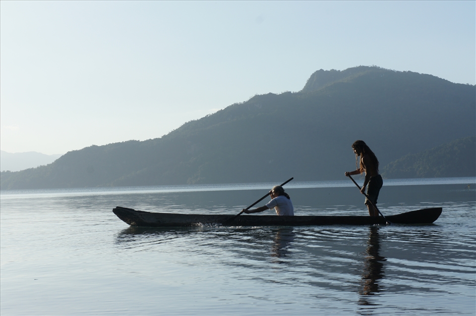 this other 2 fishermen passed by in their hand carved one piece canoe