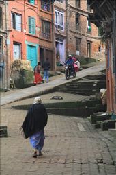 One of the main streets of the medivial town of Bhaktapur. The cobblestone streets and colorful houses compose a classic scene of the town.: by kalogiorgi, Views[424]
