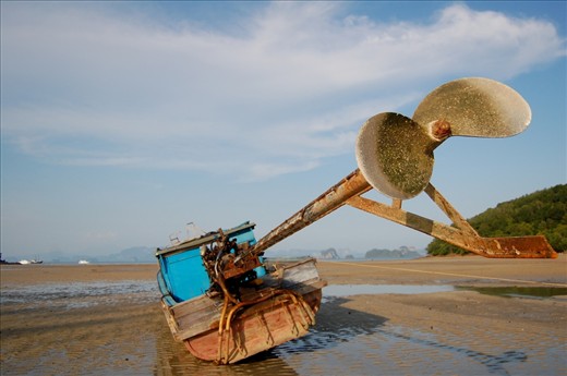 The southern region of Thailand is formed by a collection of islands separated by vast stretches of ocean. For local fishermen and other merchants, these iconic long-tail boats are vital to their freedom to roam among the islands. Taken during low tide, this picture shows a boat that has been left for the night, but will play a crucial role in its owner’s livelihood upon daybreak.