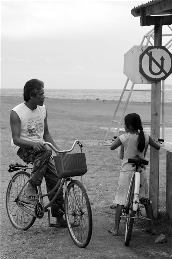 Father and daughter's daily cycle ride to the seaside.