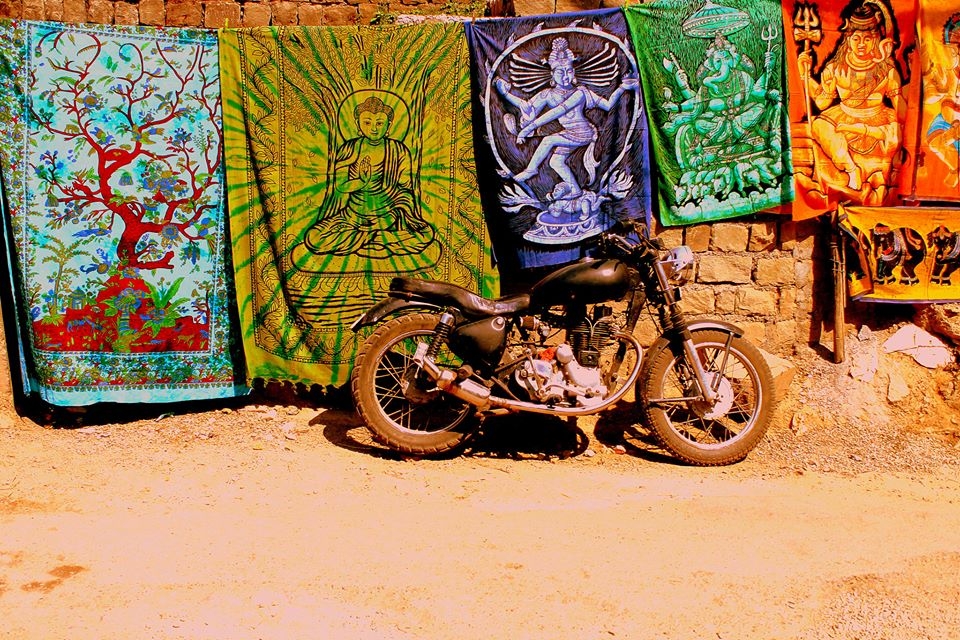 I reached Dharamshala on the morning of 23rd May. Known for its crafty works and travel enthusiasts, I got a perfect welcome from the town with colors, designs, bikers and trekkers all around. While going to my hotel on day 1, I came across this scene where a classic Royal Enfield was parked in front of a wall with the famous traditional drapes with prints of Hindu Gods put up for sale. One can see a lot of bullets around which has been a favorite for a lot of bikers here in India. The contrast in terms of the nature and color was something that attracted me to get this photographed and I knew straight away that I was going to have a great time here :)