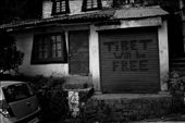 It was in 1959 when HH Dalai Lama initiated his quest to free Tibet from the clutches of Chinese government. This led to the migration of many Buddhists to India. The Indian government provided them with Dharamshala as a place to settle and flourish. On coming back from Gyoto monastery, I decided to take a late walk to Dharamkot, another small section of the Dharamshala province. This shot was taken en-route to Dharamkot which is about 14 km from Dharamshala. The route from McLeod upwards gets a bit scary as there are very less homes and shops with all the tall tress blanketing the road with very little light creeping in. The sentiments of the message on the shutter of the shop says it all, the Tibetans although have settled and made a living here, haven't forgotten the cause that they had left for.: by karankpl, Views[1145]