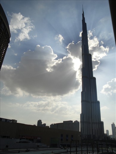 The Picture depicts the most extraordinary scene of Dubai, Burj Khalifa (Tallest tower in the world). Successfully captured it in a single shot to cover its full length. Backed by the natures play of a tussle between the clouds and the sun to catch khalifa from behind giving it a remarkable view of a Shining star in the world. To the best part the photo was clicked from a taxi driving away to the airport