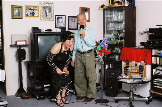Mina and Phan practice singing before going to the club every Saturday night to sing Karaoke. Phan started singing when his wife passed away to help him with his pain. Mina has been singing from a child and would regularly sing in nursing homes.