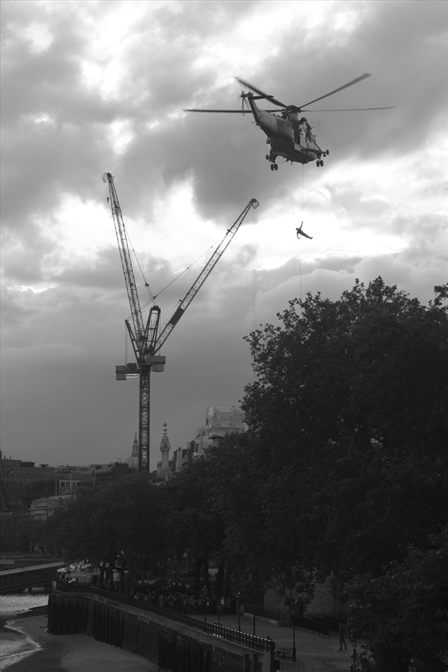 Royal Marine comes down with the Olympic torch.