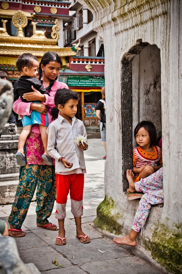 In Nepal, the sacred grounds of the temples are considered as multifunctional educational place for impoverished Nepali children especially little girls. While the boys are out begging for money or food, little Nepali girls are safe inside the temples courts… Here they pray, learn about the Gods, and get to know the basics of being good future Nepali women… They spend most of their time playing inside the temples’ alleyways. 