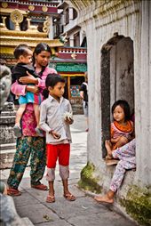 In Nepal, the sacred grounds of the temples are considered as multifunctional educational place for impoverished Nepali children especially little girls. While the boys are out begging for money or food, little Nepali girls are safe inside the temples courts… Here they pray, learn about the Gods, and get to know the basics of being good future Nepali women… They spend most of their time playing inside the temples’ alleyways. : by karimsakr, Views[543]