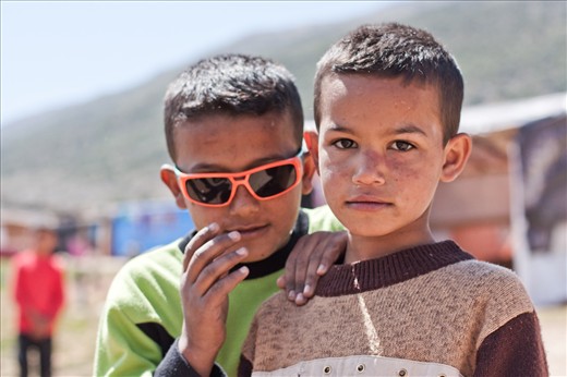 Two friends, newly met in the refugee camp, happy and have nothing to worry about in Lebanon. People are dying on the other side of the border, but not here. The best thing about being a refugee is that it’s somehow safe, at least safer than Syria where the civil war has not stopped for more than 2 years now…  It’s sad to know that these children did not go to school since the beginning of the war; but the situation is so dire for such refugees that it’s easy to overlook the importance of education… 