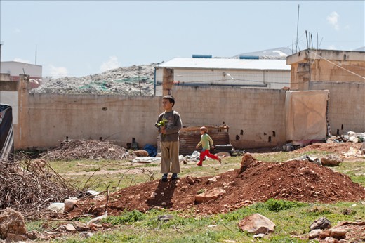 In these camps, there are many unaccompanied minors and youngsters who made the difficult journey without their parents, and who are now dealing with the pain of separation along with other problems. This photo shows how badly children need to dream of a better future and hang on to hope. Syria’s civil war is a very dehumanizing conflict, in which children pay the highest price. Maybe a smile and a flower are all these children have to change their reality. A smile is a sign of hope. A flower is a sign of love, life and peace. 