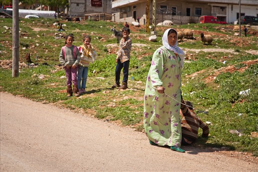 While playing together, two kids exchange something, which triggers the fury of one of the mothers who comes running angrily with a wooden branch in her hand and starts beating up her child while his friends and neighbors stand still watching him being punished.
Many children coming across the border are traumatized and some are injured, they spend their days doing nothing and waiting for the unknown… They would kill time in any possible way.