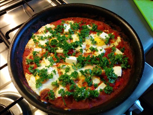 Added the eggs and feta! Almost done ...