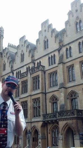 Ginger man in front of an original building (London)