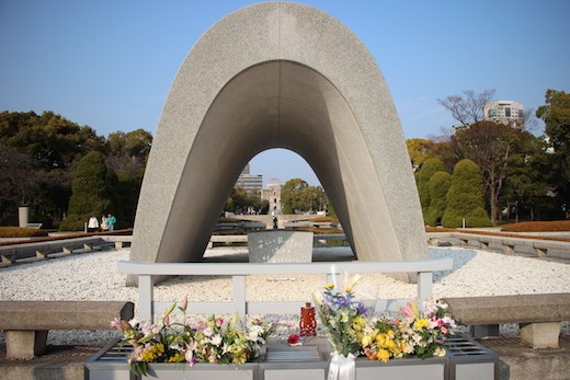 The Memorial Cenotaph is situated near the centre of the Peace Park; and holds all the names of those killed. The monument is designed to align with the Peace Flame and the A Bomb Dome as illustrated in my photograph. It was one of the first to be build in what was once an open field and opened in 1952. The arch shape used represents a shelter for the souls of the victims. 