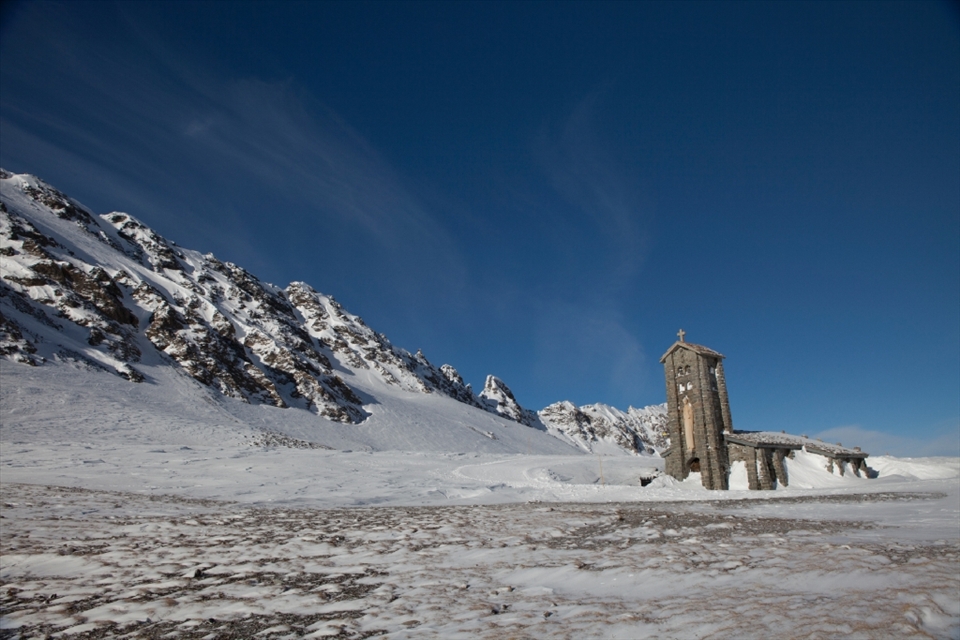 This photograph was taken off the ski path in Val D'isere, France. I went as far as I could on the ski lifts and then had taken the mountain paths to discover this church. I was struck by how, so far from any settlement, there was a church looking out towards the Italian Alps. To me, it felt like the church had been built as close to the heavens as possible.