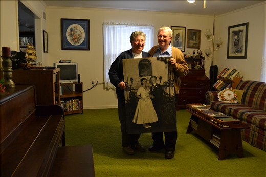 This is a picture of them in their home where they raised their children. The picture they are holding a photo poster of them on their wedding day. Memories and reminders surround grandma everyday while she still struggles to remember them. She is feels as a stranger in a world so familiar but grandpa guides her through the day and through the memories.