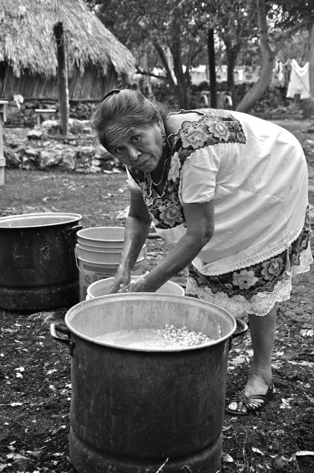 It takes a lot of strong hands to prepare tortillas for a wedding. She prepared the corn while the others slaughtered the pigs.