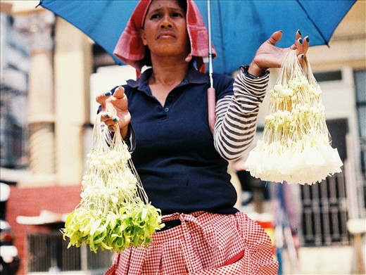 A woman keeps working despite the heat.