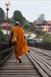 Monks frequently cross this bridge to get to the various temples; I love how their orange robes always stand out and make such a main feature of the photo. What was so great about this monk is he had a Canon camera better than mine, and was set on getting some great shots too.: by katpayne, Views[216]
