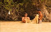 It is mid-afternoon and despite the heat, the men wade out into the lake to check the nets and see what is going to be 'catch of the day'.: by katpayne, Views[321]