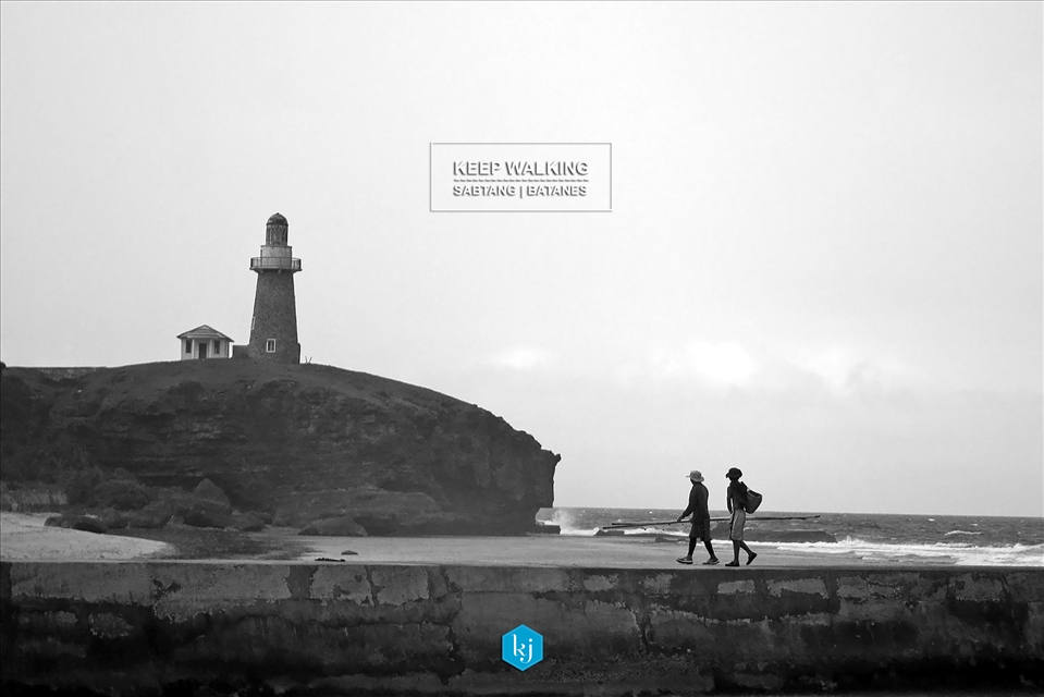 Unguided. Fishermen walking home with a view of Sabtang Lighthouse in Batanes
